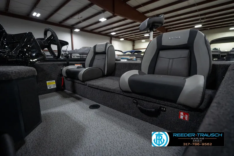 Slide: The Image of Control panel of 2026 Lund 1775 Renegade boat with RPM gauge and switches. - 29