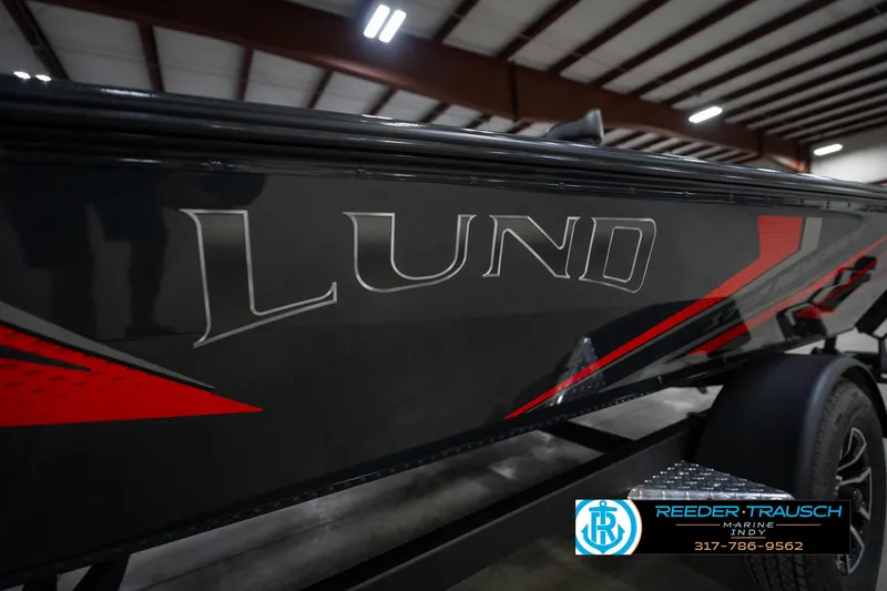 Slide: The Image of 2026 Lund 1775 Renegade boat interior with custom panel and cup holder. - 35