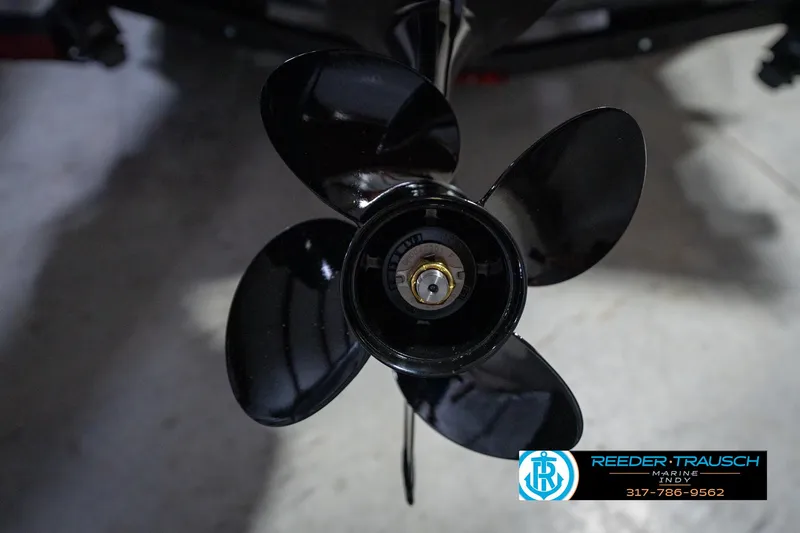 Slide: The Image of 2026 Lund 1775 Renegade boat with sleek black and red design in showroom. - 40