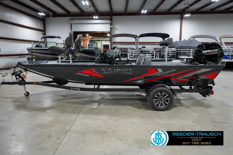 Slide: The Image of 2026 Lund 1775 Renegade boat interior with swivel seats and carpeted deck. - 9