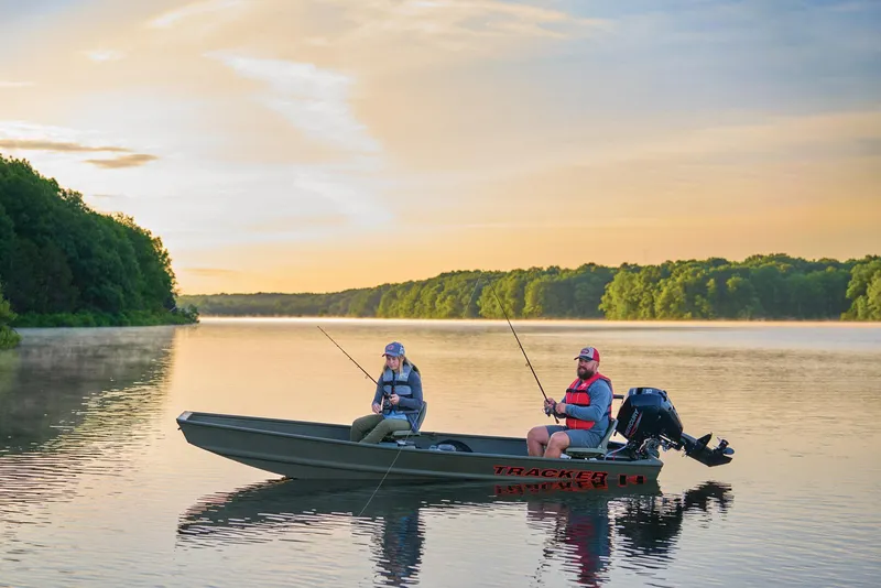 Slide: The Image of Manufacturer Provided Image: Two people fishing on a 2026 Tracker Grizzly 14 Jon boat at sunrise. - 37