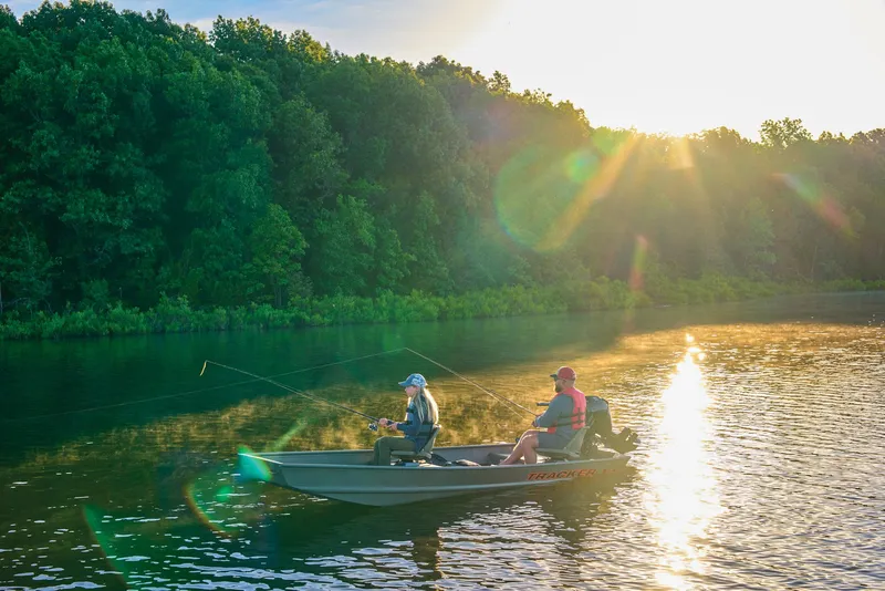Slide: The Image of Manufacturer Provided Image: Two people fishing on a 2026 Tracker Grizzly 14 Jon boat at sunset. - 39