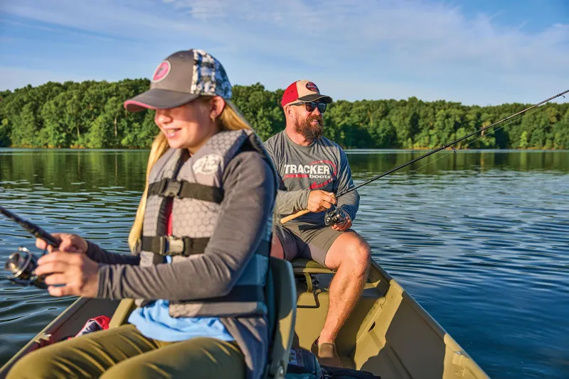 Slide: The Image of Manufacturer Provided Image: Two people fishing on a 2026 Tracker Grizzly 14 Jon boat in a serene lake. - 45