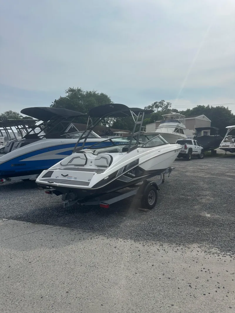Slide: The Image of 2018 Yamaha Boats AR195 on trailer in a boatyard. - 5