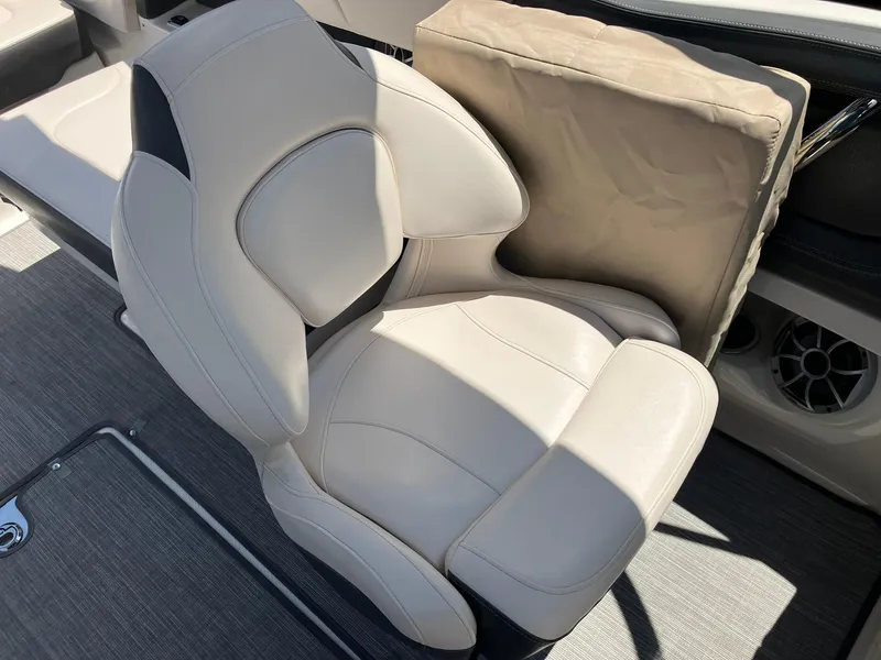 Slide: The Image of 2017 Chaparral 257 SSX boat seat with beige upholstery and cushion. - 20