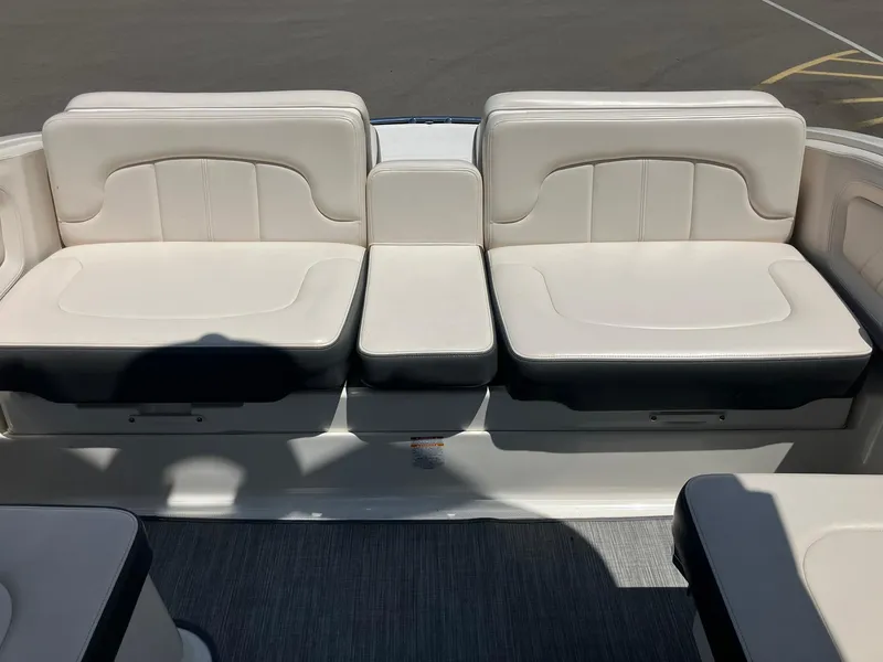Slide: The Image of 2017 Chaparral 257 SSX boat interior with white cushioned seating. - 21