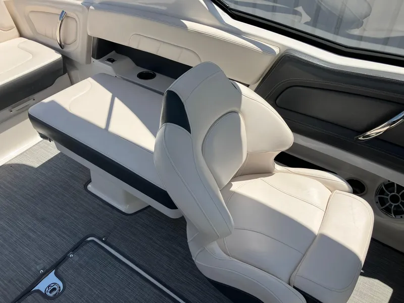 Slide: The Image of 2017 Chaparral 257 SSX boat interior with white leather seating and modern design. - 22
