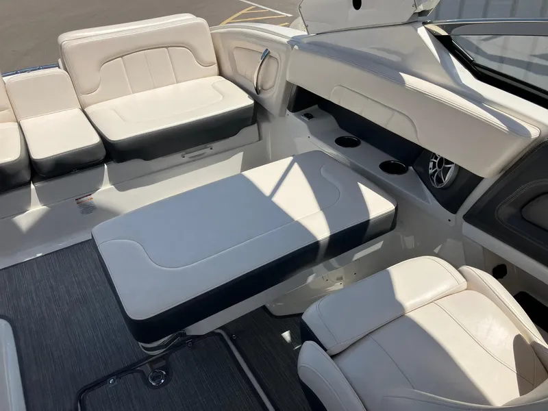 Slide: The Image of Interior of 2017 Chaparral 257 SSX boat with white leather seating and cup holders. - 23