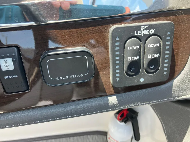 Slide: The Image of Control panel of a 2017 Chaparral 257 SSX boat with engine status and Lenco trim tabs. - 26