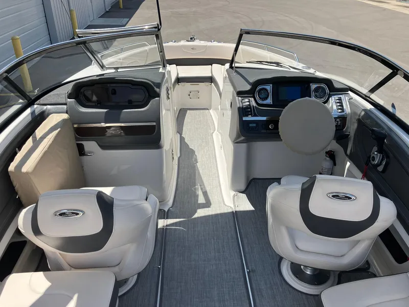 Slide: The Image of 2017 Chaparral 257 SSX boat interior with modern dashboard and seating. - 9