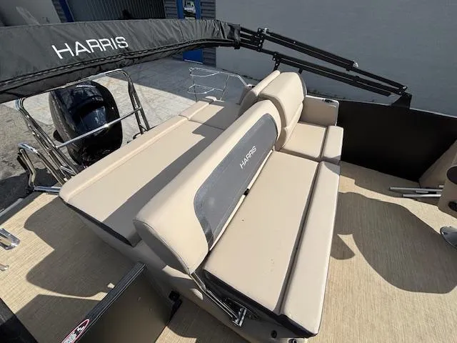 Slide: The Image of 2025 Harris CRUISER 230 SLDH boat with beige seating and black canopy. - 15