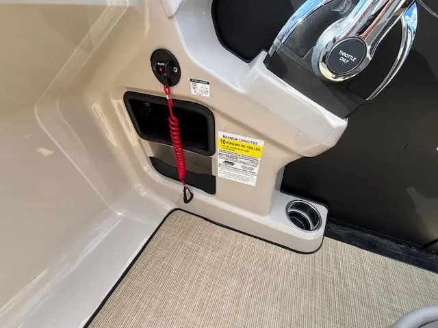 Slide: The Image of 2025 Harris CRUISER 230 SLDH boat console with throttle and safety features. - 22