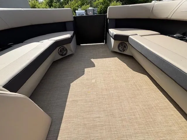 Slide: The Image of 2025 Harris CRUISER 230 SLDH interior with beige seating and carpet flooring. - 28