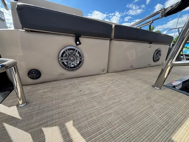 Slide: The Image of 2025 Harris CRUISER 230 SLDH boat interior with speakers and cushioned seating. - 29