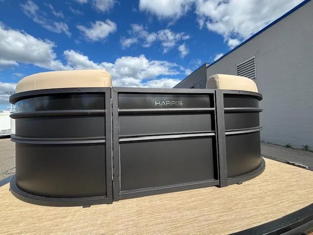 Slide: The Image of 2025 Harris CRUISER 230 SLDH pontoon boat under a blue sky. - 8