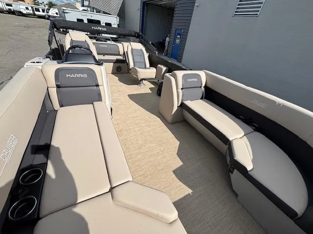 Slide: The Image of 2025 Harris CRUISER 230 SLDH pontoon boat with spacious seating and modern design. - 9