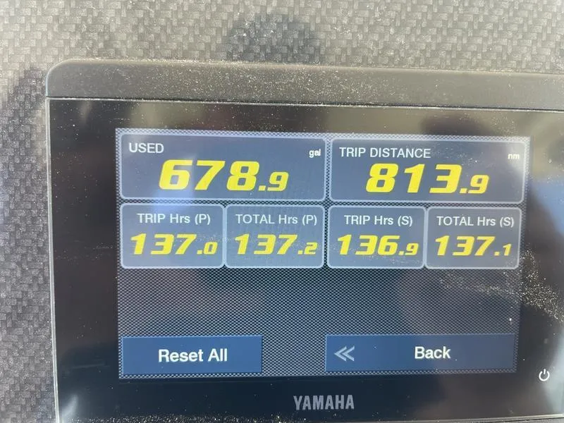 Slide: The Image of Display screen showing fuel usage and trip data for 2024 Grady-White 306 CANYON boat. - 2