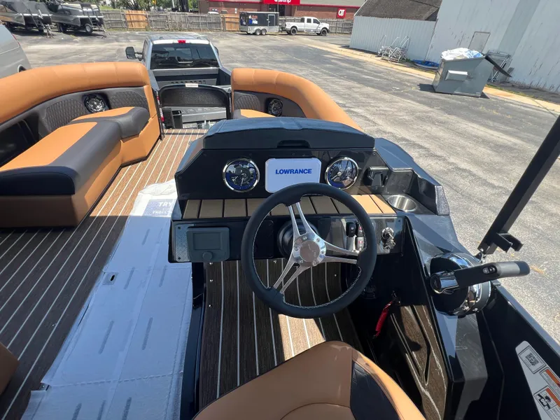 Slide: The Image of 2026 Premier 230 SunSation Angler boat interior with steering wheel and seating. - 2