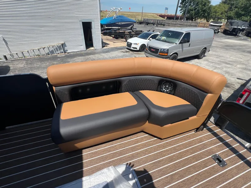 Slide: The Image of Luxurious seating on 2026 Premier 230 SunSation Angler boat, featuring tan and black upholstery. - 5