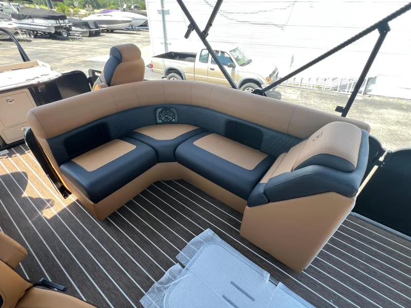 Slide: The Image of Luxurious seating on 2026 Premier 230 SunSation Angler boat, featuring tan and black upholstery. - 6