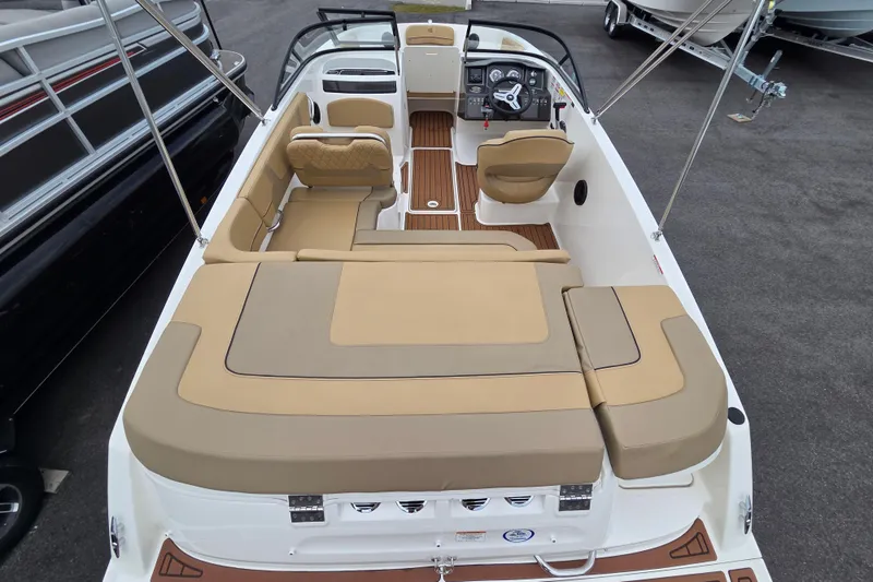 Slide: The Image of 2024 Bayliner VR5 Bowrider I/O with tan seating and sleek interior design. - 10