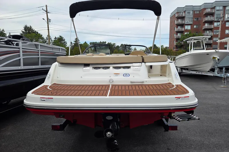 Slide: The Image of 2024 Bayliner VR5 Bowrider I/O with teak deck, parked in marina. - 5