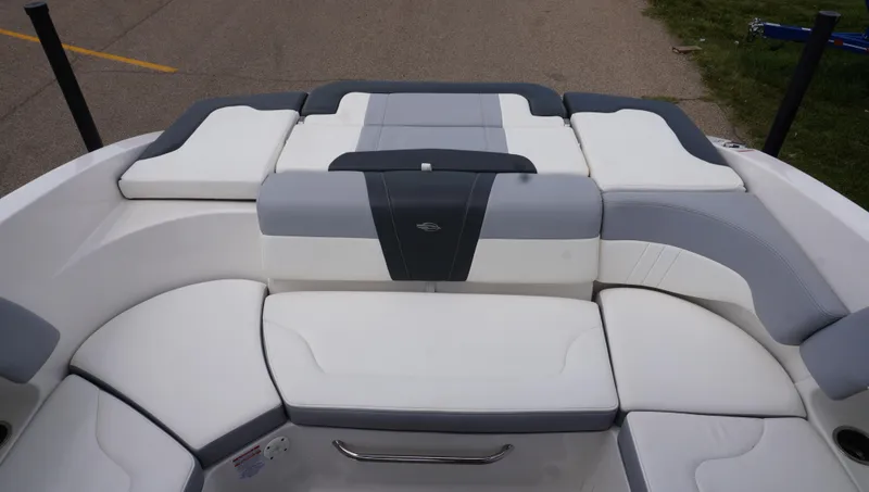 Slide: The Image of 2022 Chaparral 23 SSi boat interior with white and gray seating. - 10