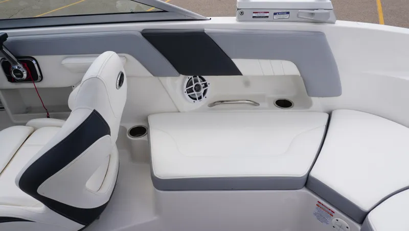 Slide: The Image of 2022 Chaparral 23 SSi boat interior with white seating and modern design. - 11