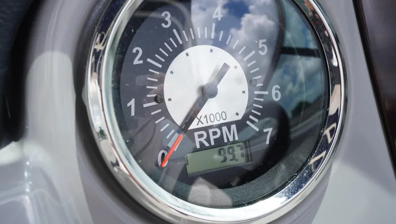 Slide: The Image of Close-up of 2022 Chaparral 23 SSi tachometer showing RPM gauge with reflections. - 14