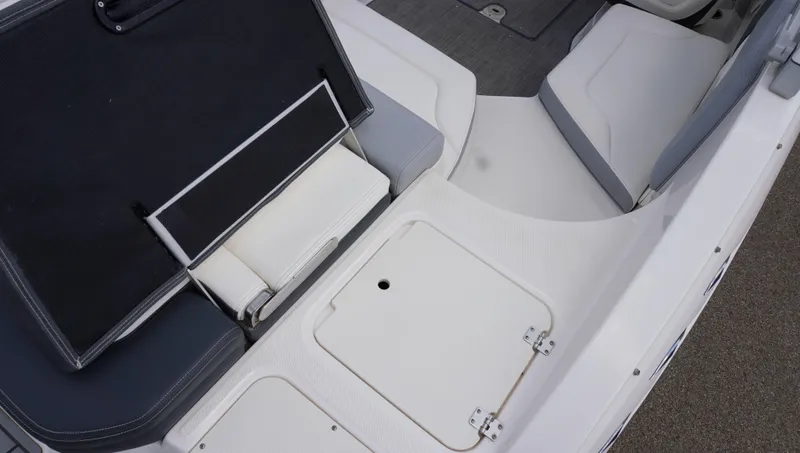 Slide: The Image of 2022 Chaparral 23 SSi boat interior with seating and storage compartments. - 7