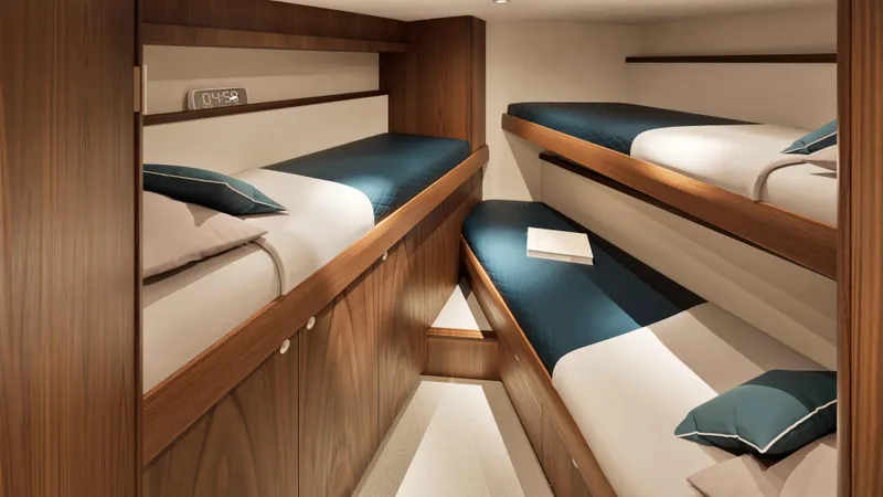 Slide: The Image of Luxurious cabin with four bunk beds in 2026 Hatteras 77 Convertible yacht. - 11