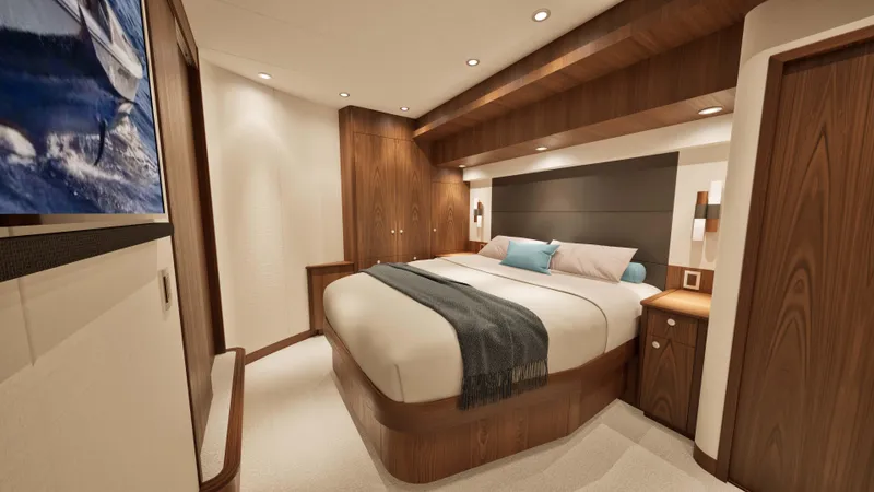 Slide: The Image of Luxurious bedroom interior of 2026 Hatteras 77 Convertible yacht with modern wood finishes. - 9