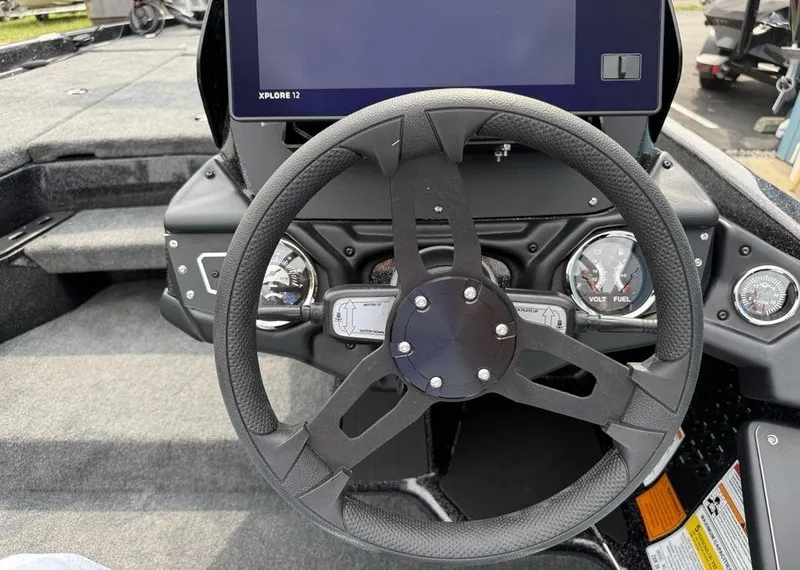 Slide: The Image of Steering wheel and dashboard of 2025 Skeeter ZXR20 boat with digital display. - 15