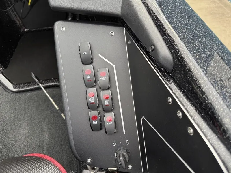 Slide: The Image of Control panel of 2025 Skeeter ZXR20 boat with various switches and buttons. - 18