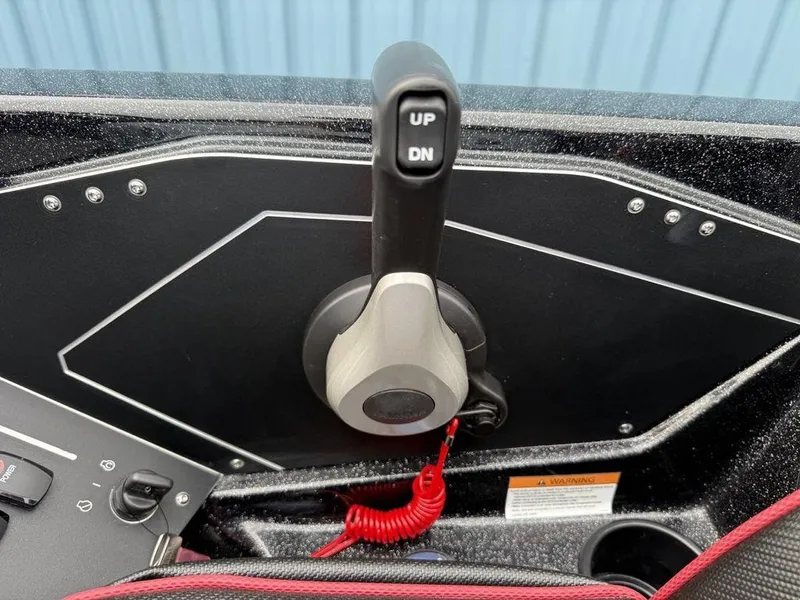 Slide: The Image of Throttle control panel of 2025 Skeeter ZXR20 boat with up and down buttons. - 19