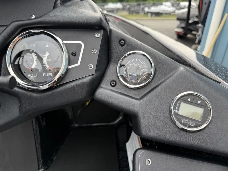 Slide: The Image of Dashboard of 2025 Skeeter ZXR20 boat with volt, fuel, and water pressure gauges. - 22