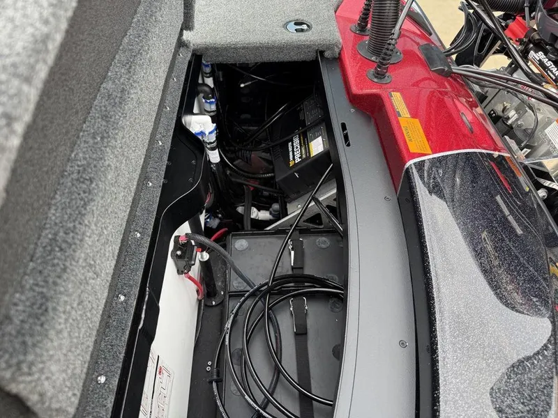 Slide: The Image of 2025 Skeeter ZXR20 boat interior showing battery compartment and wiring. - 23