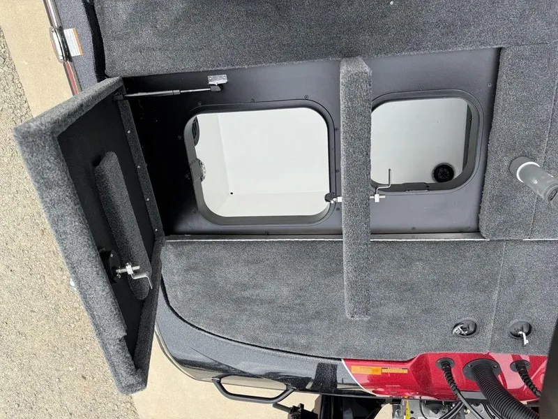 Slide: The Image of Interior view of 2025 Skeeter ZXR20 boat storage compartment with open hatch. - 26