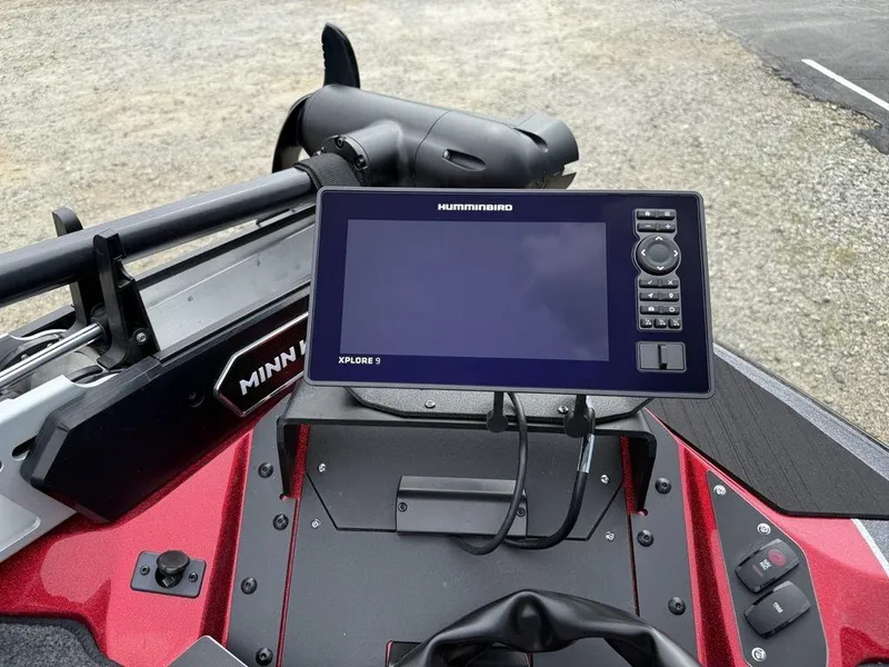 Slide: The Image of 2025 Skeeter ZXR20 boat dashboard with Humminbird Xplore 9 display and Minn Kota trolling motor. - 5