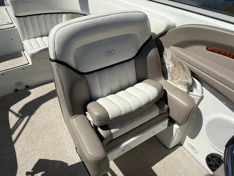 Slide: The Image of Luxurious seating on a 2002 Cobalt 262 boat with beige and white upholstery. - 11