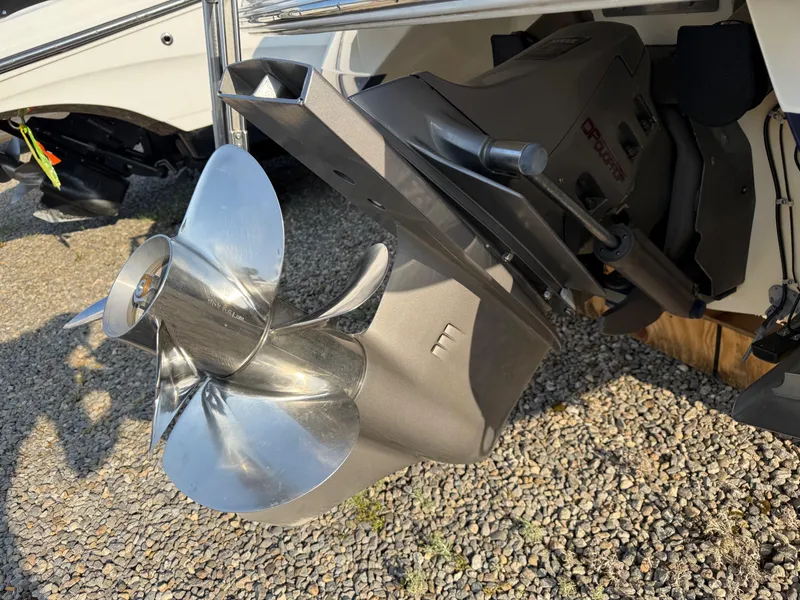 Slide: The Image of Close-up of a 2002 Cobalt 262 boat propeller on gravel surface. - 19