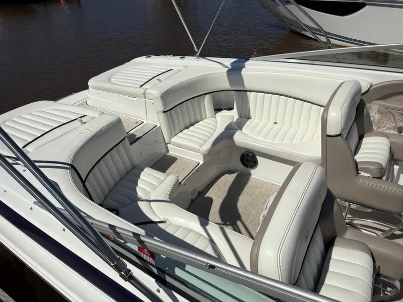 Slide: The Image of 2002 Cobalt 262 boat interior with white leather seating and spacious layout. - 3