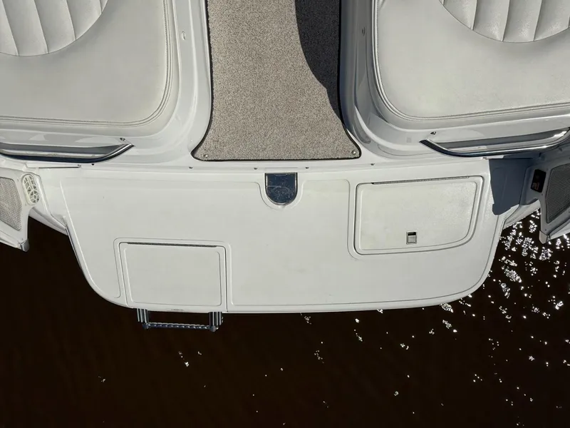 Slide: The Image of Rear deck of a 2002 Cobalt 262 boat with seating and water reflection. - 5