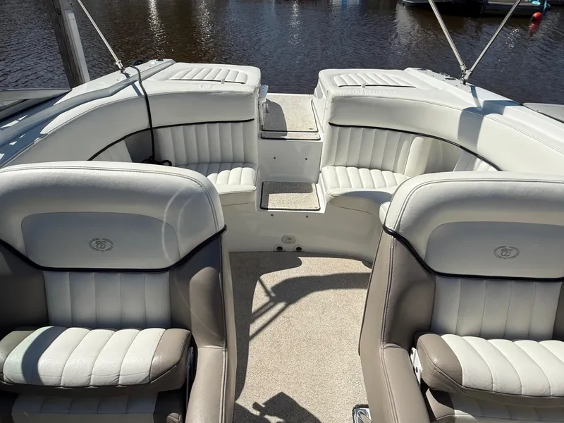 Slide: The Image of Interior of a 2002 Cobalt 262 boat with white and beige seating. - 9