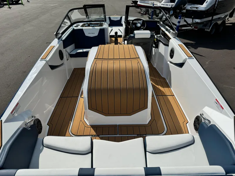 Slide: The Image of 2025 Nautique Ski 200 boat interior with sleek design and wood accents. - 10
