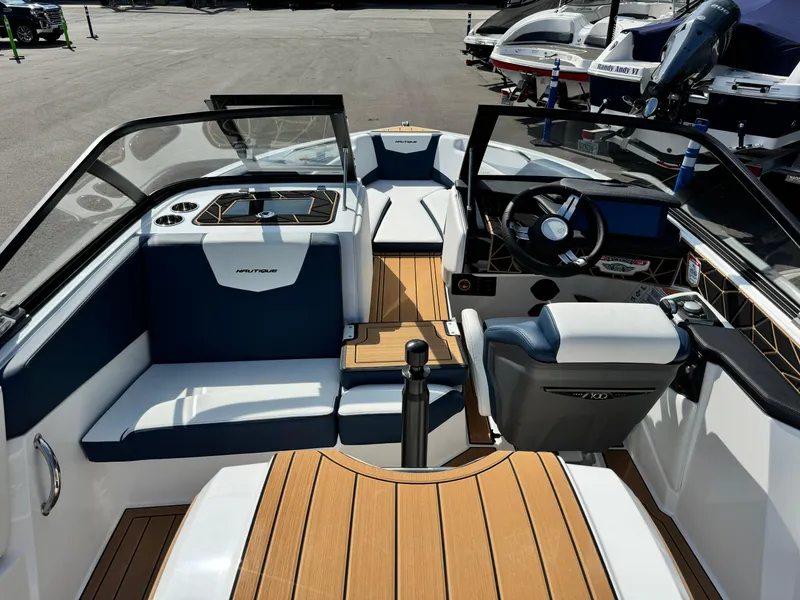 Slide: The Image of 2025 Nautique Ski 200 boat interior with sleek design and modern dashboard. - 11