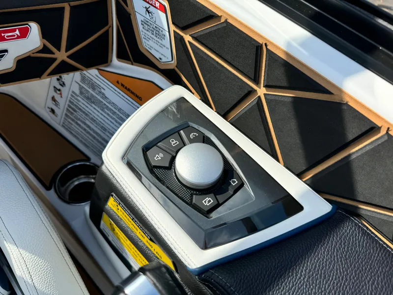 Slide: The Image of Control panel of 2025 Nautique Ski 200 boat with geometric design accents. - 26