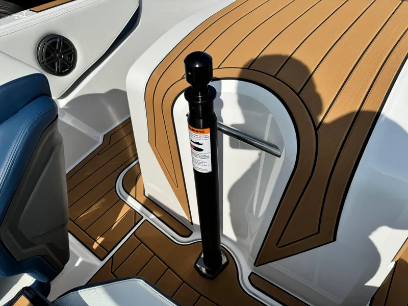 Slide: The Image of 2025 Nautique Ski 200 interior with teak flooring and sleek design elements. - 28