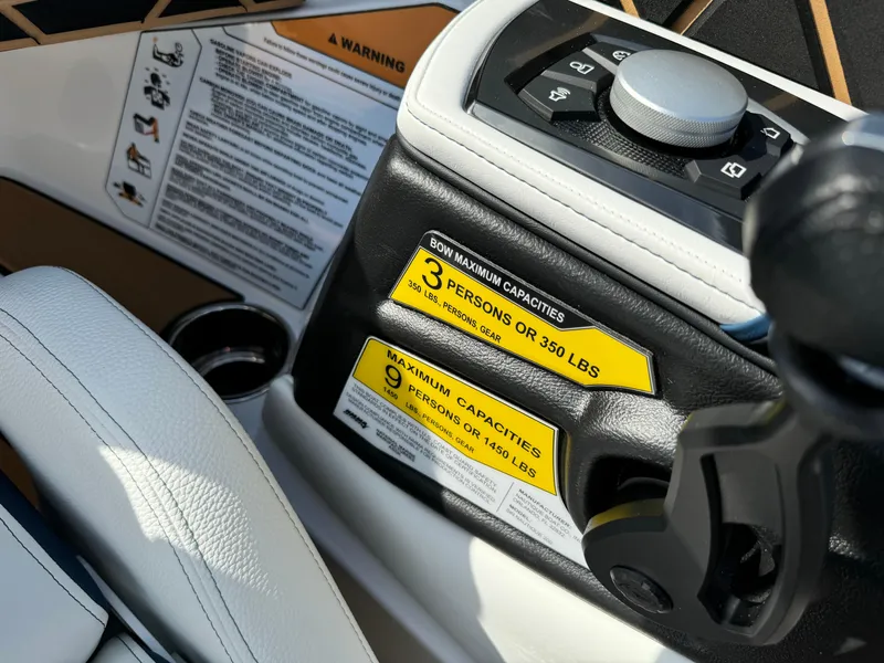 Slide: The Image of 2025 Nautique Ski 200 dashboard with capacity labels and control panel. - 37