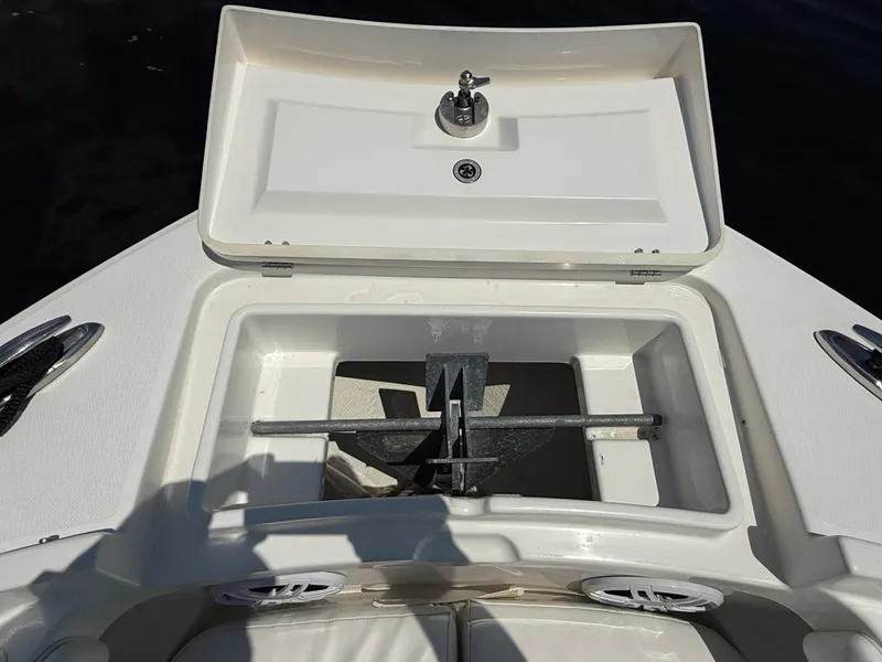 Slide: The Image of 2018 Regulator 23 boat anchor compartment with open hatch. - 26